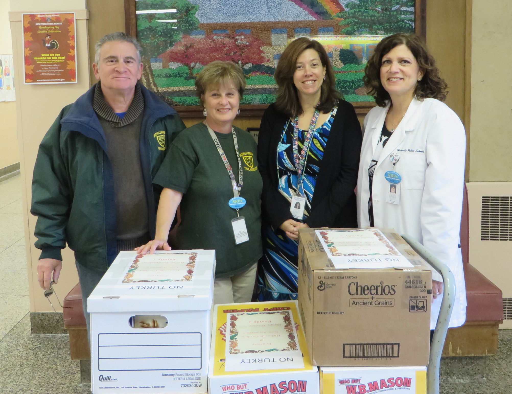 From left to right is the Nicholas Mirro, Christina Mirro co-chair HGCA Community Service, Mrs. Stam, principal of Lee Avenue School, and Mrs. Kravitz, the school nurse.